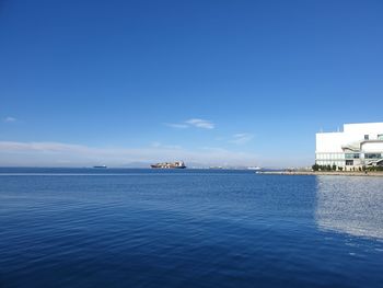 Scenic view of sea against blue sky