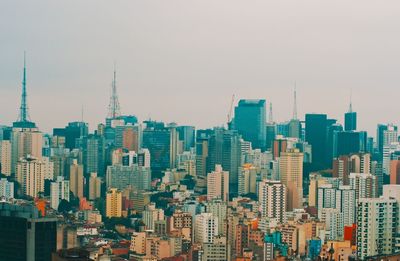 Modern buildings in city against sky