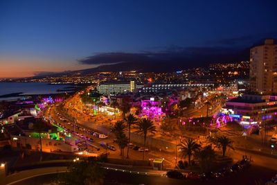 High angle view of illuminated buildings in city at night