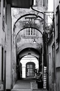 Narrow alley amidst old buildings in city