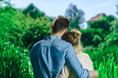 Rear view of couple on grass