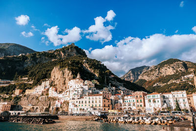 Panoramic view of townscape by sea against sky