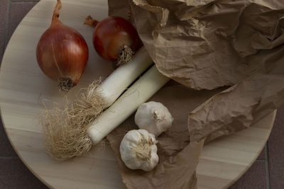 High angle view of a group of vegetables with garlics onions and leeks