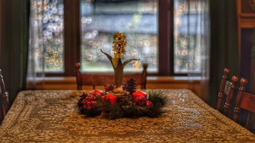 Close-up of christmas decorations on table at home