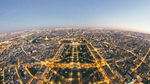 Aerial view of city buildings against clear sky