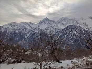 Scenic view of snowcapped mountains against sky