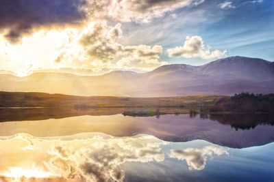 Scenic view of lake against sky during sunset