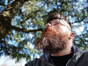 Low angle view of man wearing sunglasses