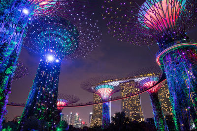 Low angle view of illuminated ferris wheel at night