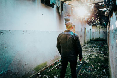 Rear view of man walking on street