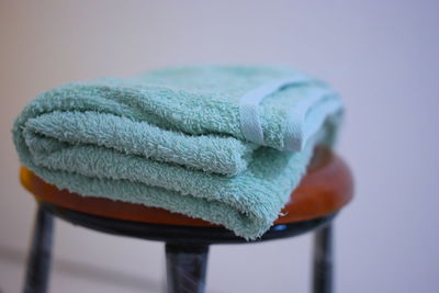 Close-up of towel on chair