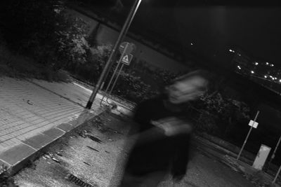 Blurred motion of man at night