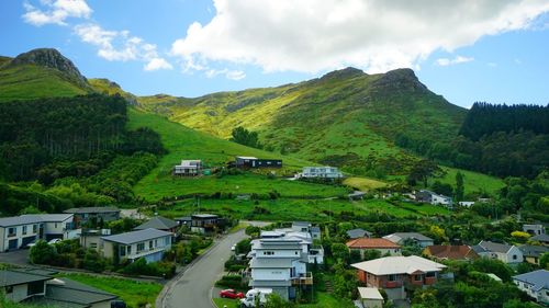 High angle view of buildings and trees against sky