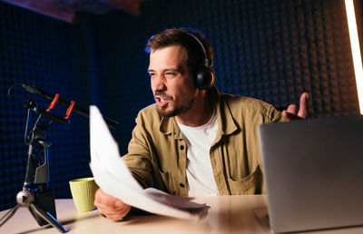 Young man using laptop at home