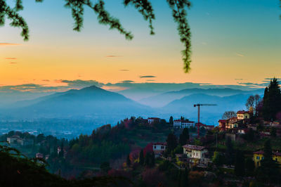 View of cityscape against sky at sunset