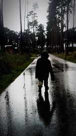 Woman walking on road