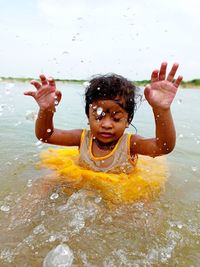 Full length of girl in water