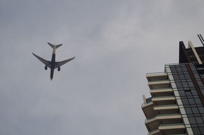 Low angle view of airplane flying in sky