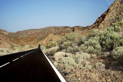 Scenic view of arid landscape against clear sky