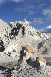 Rock formations on mountain against sky