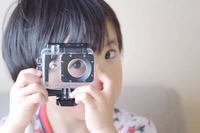 Child playing with camera