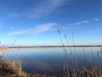 Scenic view of lake against blue sky