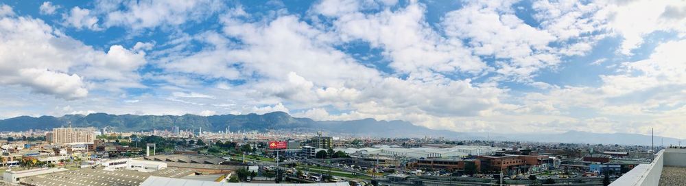 High angle view of townscape against cloudy sky