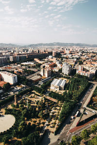 High angle view of buildings in city against sky