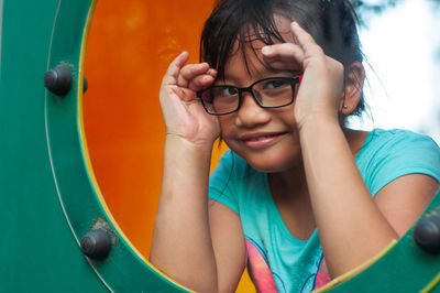 Close-up of girl playing on ground