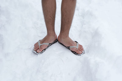 Low section of man standing outdoors