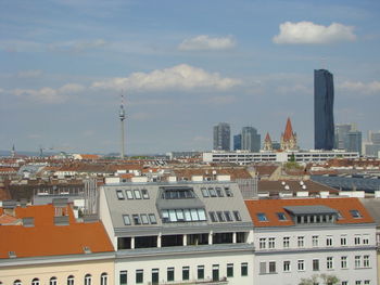 Buildings in city against sky