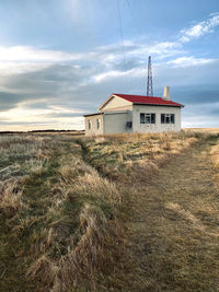 House on field against sky