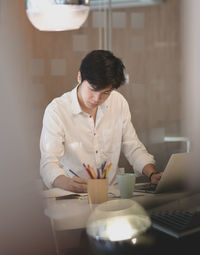 Woman using laptop on table