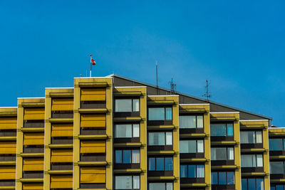 Low angle view of building against blue sky