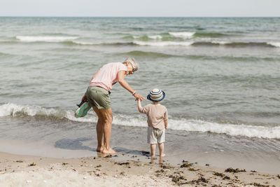 Grandmother with grandson at sea