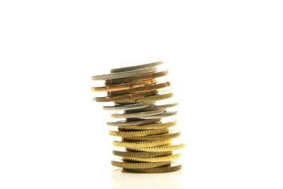 Stack of coin against white background