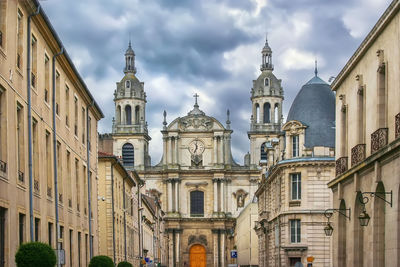 Low angle view of cathedral against cloudy sky