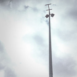 Low angle view of street light against sky