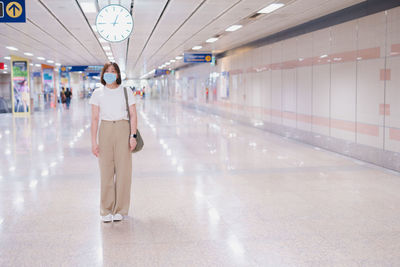 Solo asian woman wearing protective mask during transport to work or travel