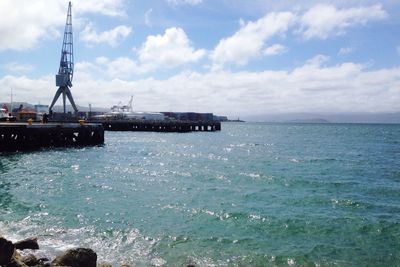 Scenic view of sea against cloudy sky