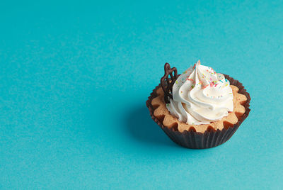 High angle view of cupcakes against blue sky