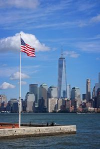 Flag with city in background