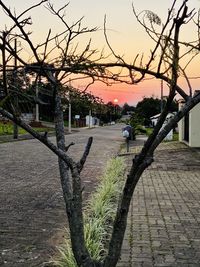 View of street against sky at sunset
