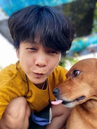 Portrait of cute boy with dog