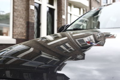 Close-up of car on street