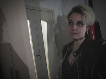 Portrait of woman standing at home