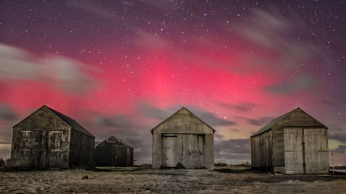 Boat sheds northern lights