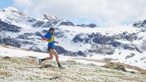 Athlete runner during a mountain workout in spring