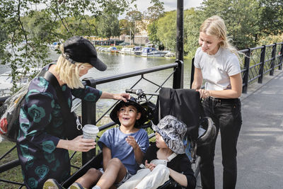 Mothers with children in bicycle carriage