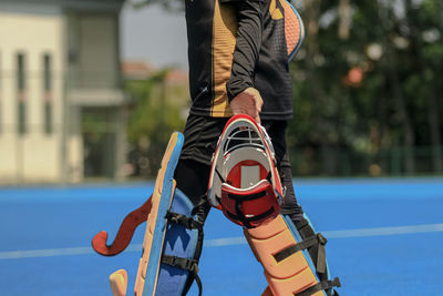 Low section of man standing in gym